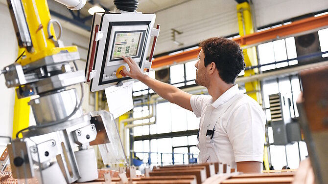 A man operates an industrial machine