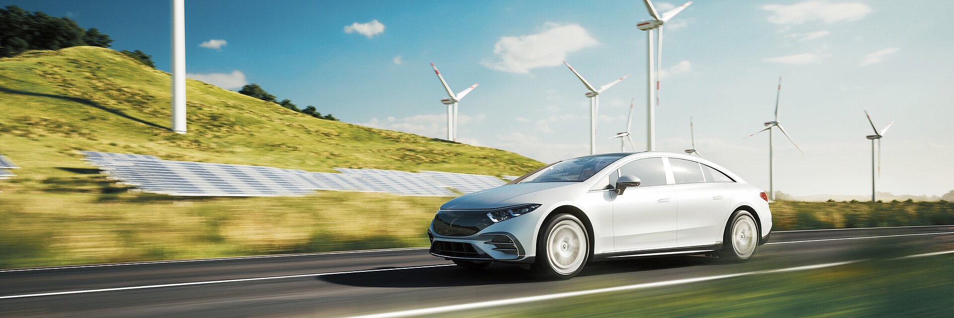 Une voiture de sport électrique roule à côté d'installations solaires et d'éoliennes
