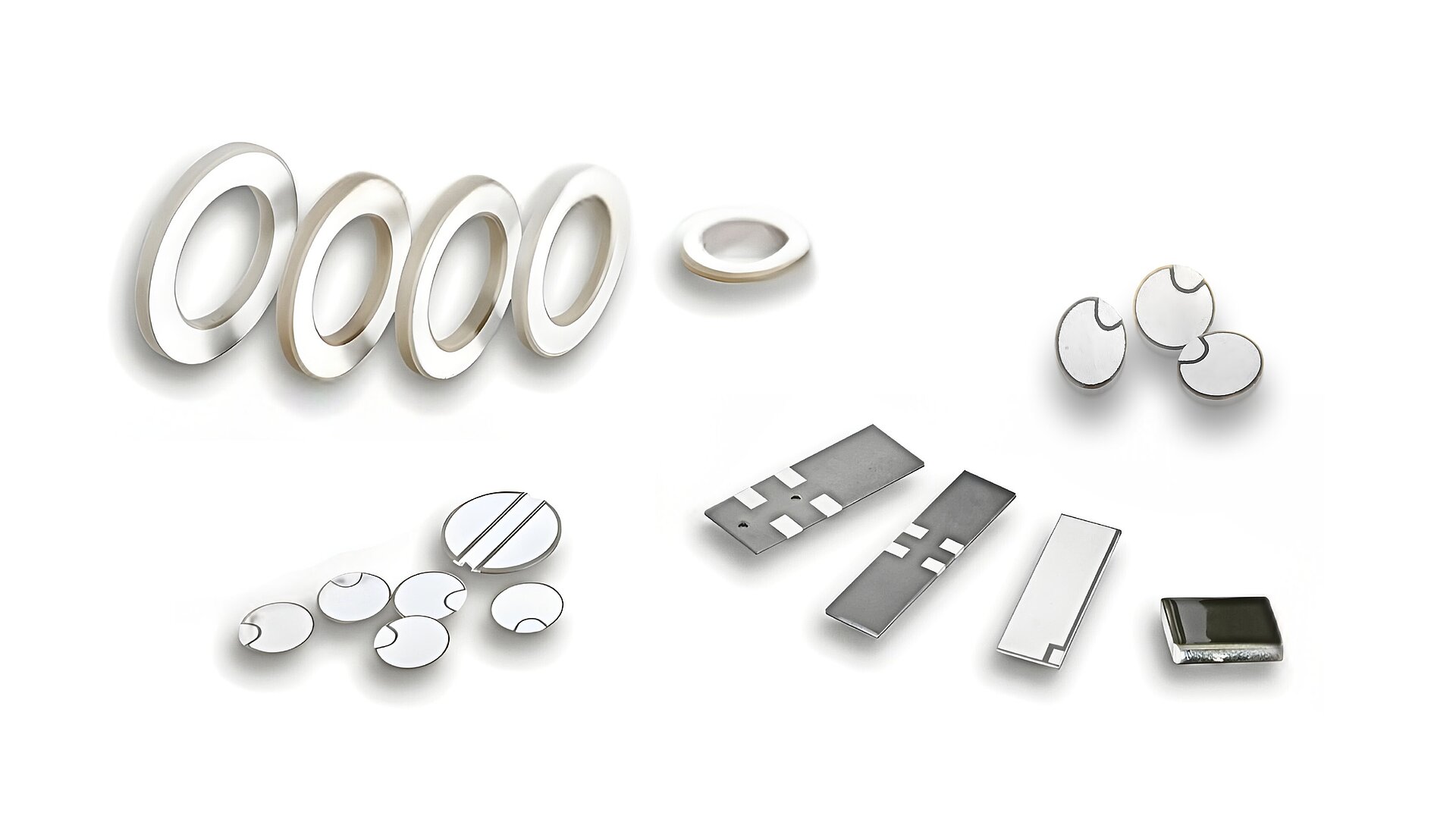 Divers produits et composants piézocéramiques pour le secteur automobile sur fond blanc