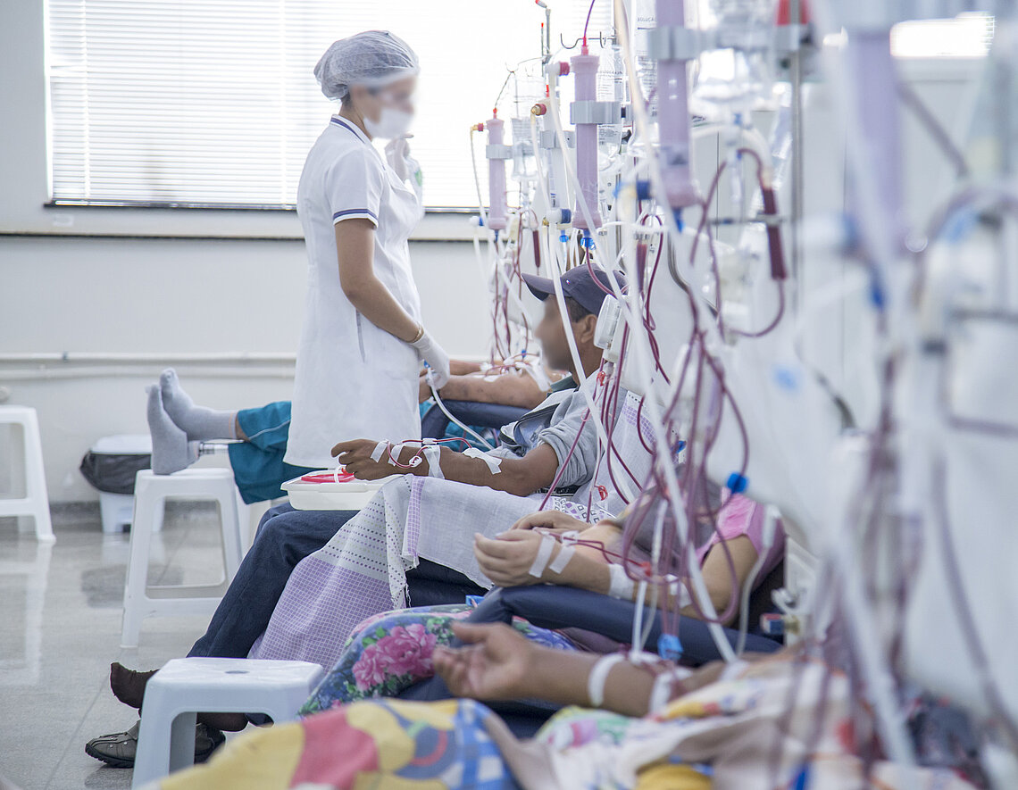 Dialysis patients sitting in a row