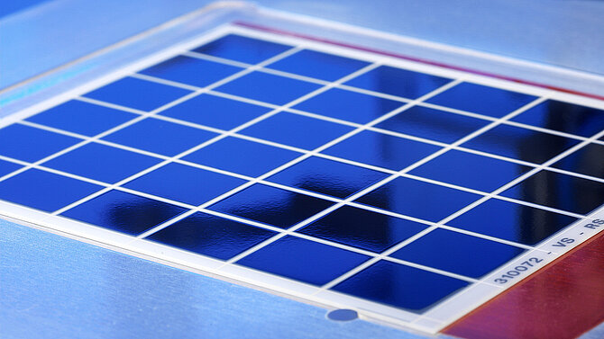 A blue metallised substrate is being machined.