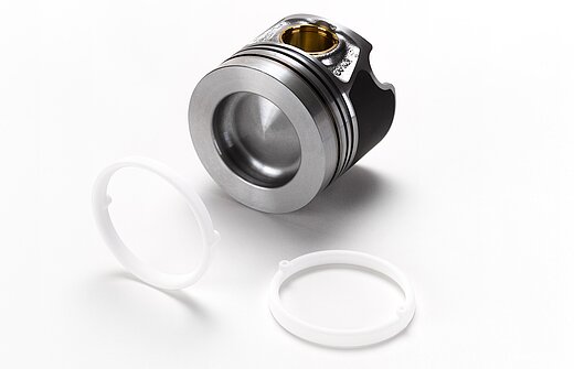 A silver metal piece and white salt cores for foundry technology