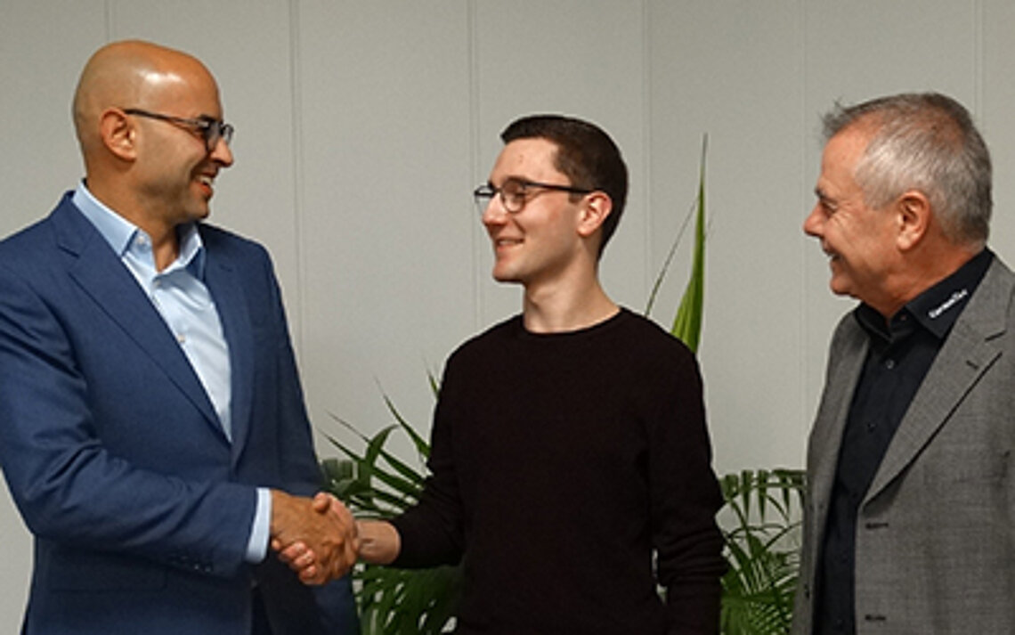 Boss and employee shake hands