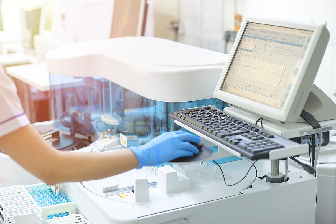 Woman in lab checks results