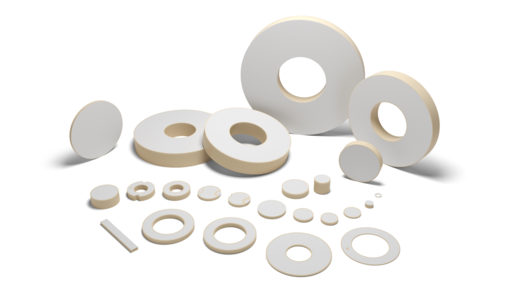 Various lead-free piezo ceramic components on a white background