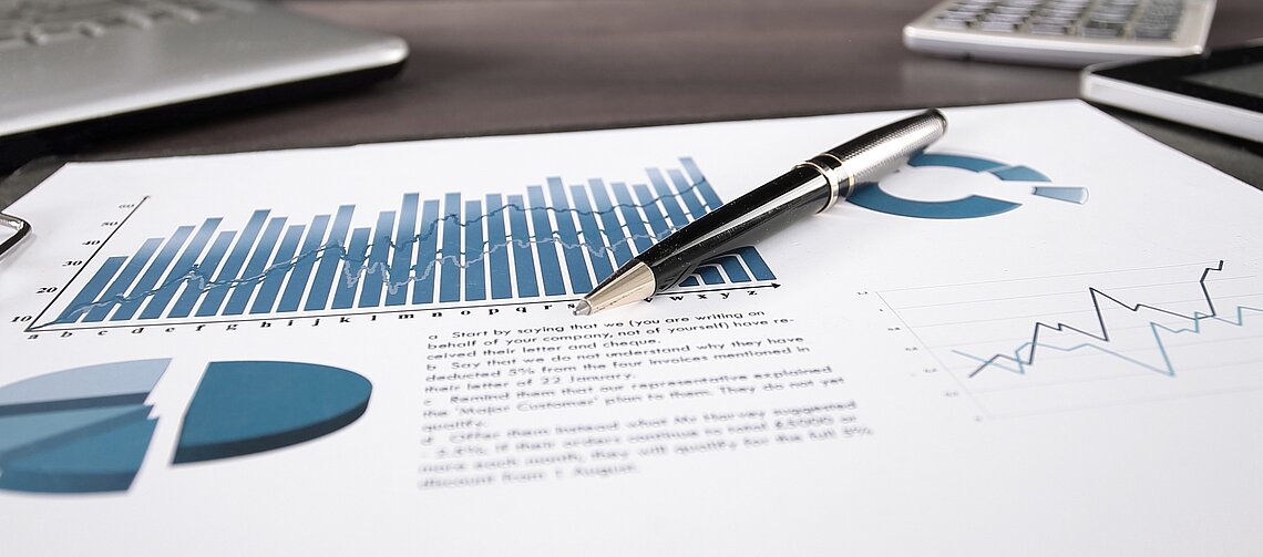 Pen on Paper with financial Results