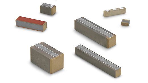 Various piezoceramic actuators from CeramTec on a white background