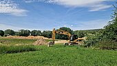 Excavator starts construction on a greenfield site