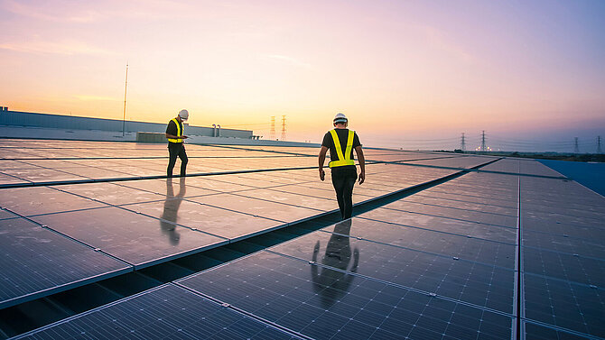 Engineer service check installation solar cell on the roof of factory