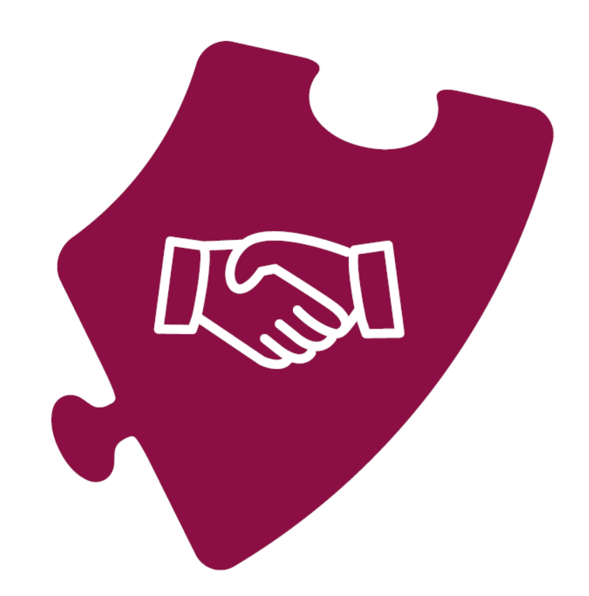 A piece of puzzle with shaking hands on it